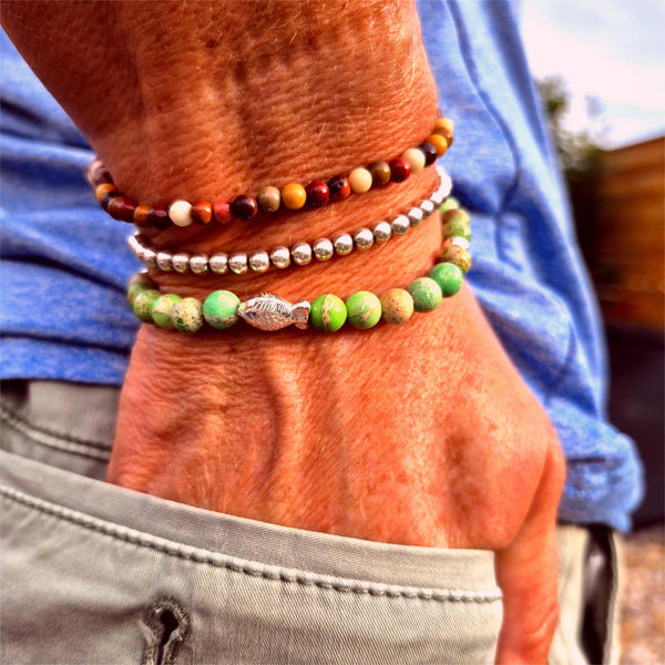 This super cute handmade bracelet features 6mm green imperial jasper beads paired with sterling silver accents and an adorable fish charm. Stretchy and comfy, it fits most adult wrists up to 7.5 inches (19cm). Perfect for anyone who adores the sea!

**Presented in lovely Kraft paper gift box with reusable organza pouch**