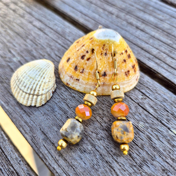 Lovely peach cream tones in these handmade agate cube earrings, featuring a faceted glass bead and natural stone disc. Gold plated accent beads and hooks add a vintage feel.
Length from bottom of hook - 30mm

A perfect gift or spring wardrobe essential.