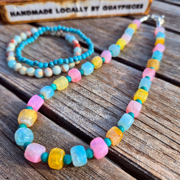 Fun, pastel agate cubes accented with 4mm turquoise magnesite beads create a playful, on-trend necklace perfect for adding colour to any outfit. Silver plated lobster clasp and delicate starfish charms complete the beach design. 42cm/16.5in length suits most wearers.