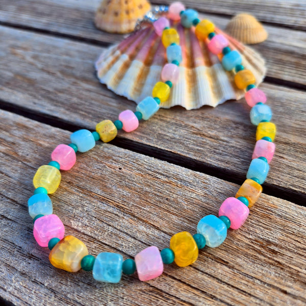 Fun, pastel agate cubes accented with 4mm turquoise magnesite beads create a playful, on-trend necklace perfect for adding colour to any outfit. Silver plated lobster clasp and delicate starfish charms complete the beach design. 42cm/16.5in length suits most wearers.