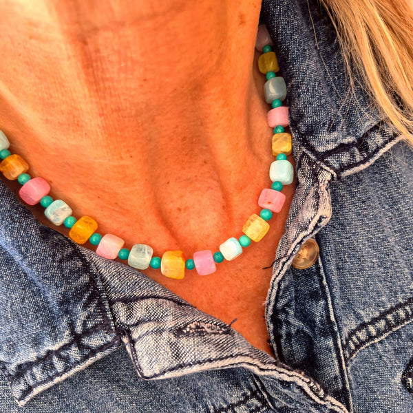 Fun, pastel agate cubes accented with 4mm turquoise magnesite beads create a playful, on-trend necklace perfect for adding colour to any outfit. Silver plated lobster clasp and delicate starfish charms complete the beach design. 42cm/16.5in length suits most wearers.