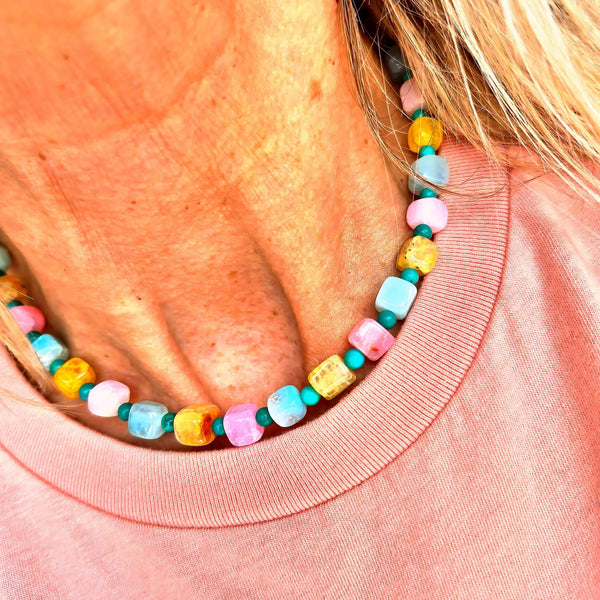 Fun, pastel agate cubes accented with 4mm turquoise magnesite beads create a playful, on-trend necklace perfect for adding colour to any outfit. Silver plated lobster clasp and delicate starfish charms complete the beach design. 42cm/16.5in length suits most wearers.
