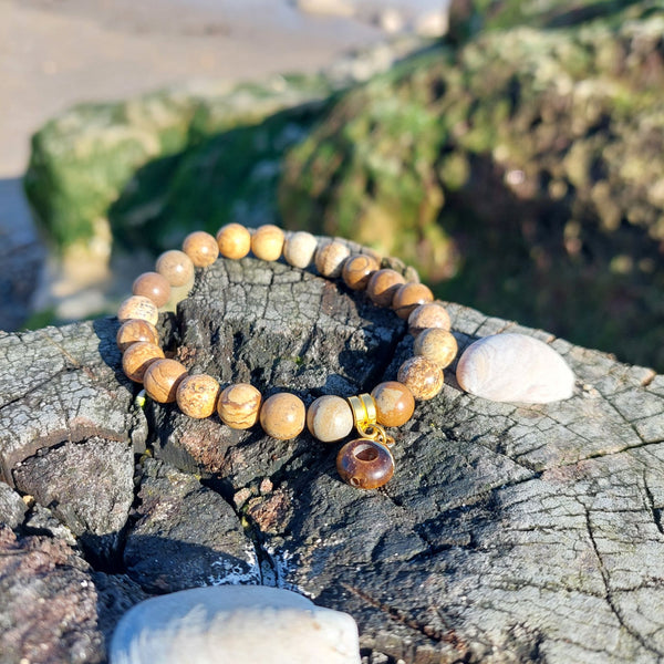 8mm Brown Marble Effect Natural Stone Bead Bracelet with gold plated circular charm Elasticated, so will fit most adult wrists (measuring 71/2 in/19cm) Perfect for wearing with those winter outfits & a lovely gift for friends or family **Presented in lovely Kraft paper gift box with reusable organza pouch**