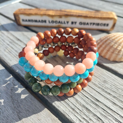 ﻿Cool handmade bracelets made with 8mm wood & natural stone beads  Choose from Pink Quartz, Turquoise Calcite, Dalmatian Jasper, Green Serpentine or Multi Aqua natural stone   Because this is a natural product, no bead is the same  Elasticated, so will fit most adult wrists (measuring 71/2 in/19cm)  **Presented in lovely Kraft paper gift box with reusable organza pouch**