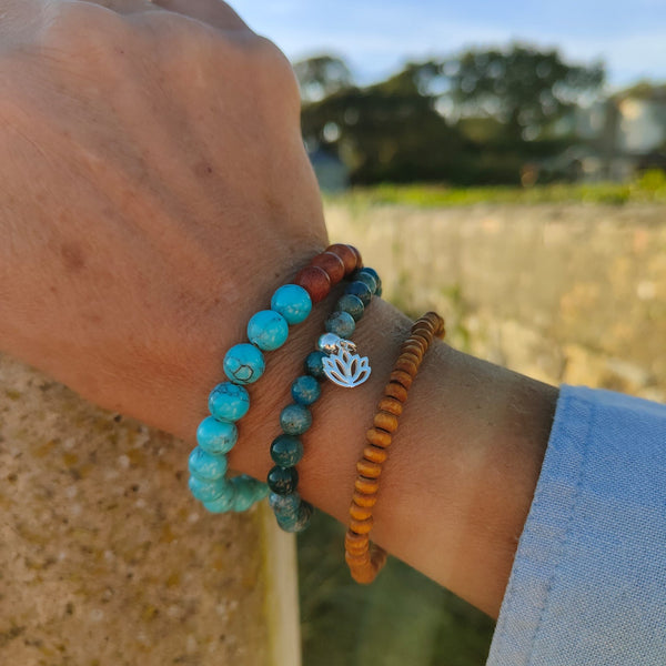 ﻿Cool handmade bracelets made with 8mm wood & natural stone beads  Choose from Pink Quartz, Turquoise Calcite, Dalmatian Jasper, Green Serpentine or Multi Aqua natural stone   Because this is a natural product, no bead is the same  Elasticated, so will fit most adult wrists (measuring 71/2 in/19cm)  **Presented in lovely Kraft paper gift box with reusable organza pouch**