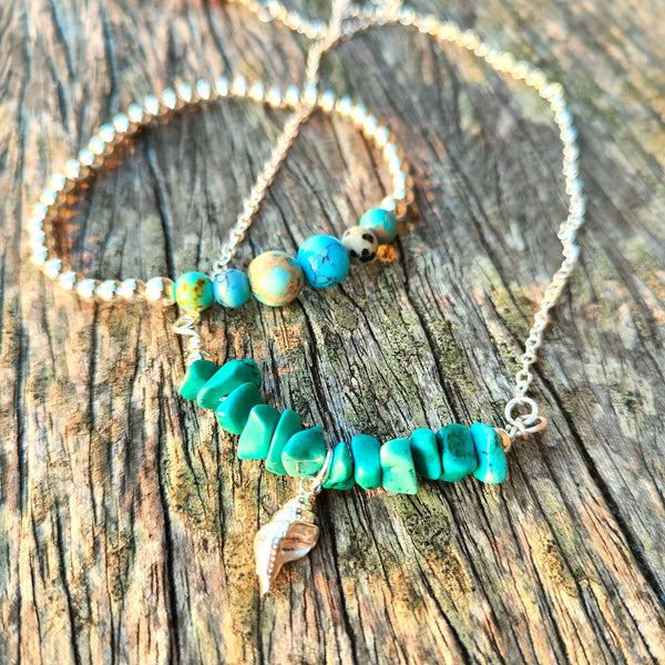 4mm Sterling Silver with ocean shades of blue natural stone & dalmatian Jasper beads﻿﻿  Super cute bracelet to wear alone or as a stack!  Elasticated, so will fit most adult wrists (measuring 7.5 in/19cm)  **Presented in lovely Kraft paper gift box with reusable organza pouch**  **Will not tarnish if cared for properly**