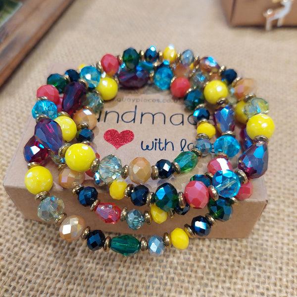 Gorgeous long necklace handmade with lovely sparkly faceted glass beads in jewel colours combined with gold plated hematite.  Each necklace is unique due to variations in the colour of the beads  Gold plated fastenings & clasp with star charm  length 71cm  Dress it up or down, a great addition to brighten up your winter outfits!  Gift wrapped & presented in a pretty organza pouch