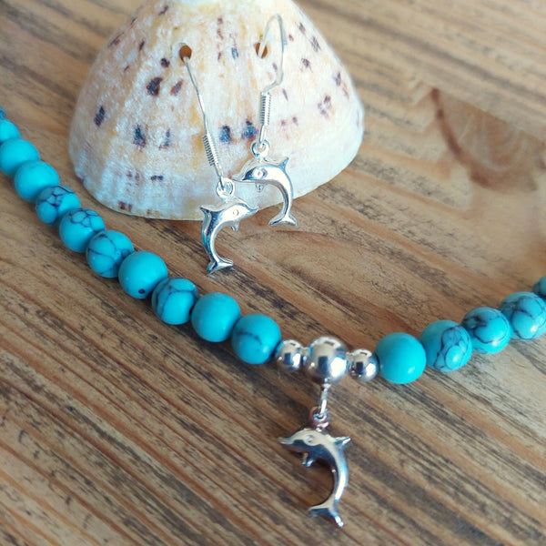 ﻿925 Hall Marked Sterling Silver  Super cute dolphin earrings  H 27 mm (from top of hook)  x W 9 mm  Gorgeous little gift for sea lovers or a treat for yourself!