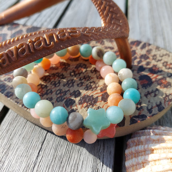 Lovely 8mm natural matt stone bead bracelet with star - available in 2 colours  1) Peach 2)Aqua green   Perfect for stacking or wearing alone!  Elasticated, so will fit most adult wrists (measuring 71/2 in/19cm)  Lovely gift for friends or family  **Presented in lovely Kraft paper gift box with reusable organza pouch**