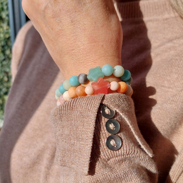 Lovely 8mm natural matt stone bead bracelet with star - available in 2 colours  1) Peach 2)Aqua green   Perfect for stacking or wearing alone!  Elasticated, so will fit most adult wrists (measuring 71/2 in/19cm)  Lovely gift for friends or family  **Presented in lovely Kraft paper gift box with reusable organza pouch**