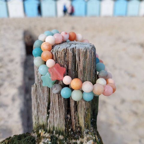 Lovely 8mm natural matt stone bead bracelet with star - available in 2 colours  1) Peach 2)Aqua green   Perfect for stacking or wearing alone!  Elasticated, so will fit most adult wrists (measuring 71/2 in/19cm)  Lovely gift for friends or family  **Presented in lovely Kraft paper gift box with reusable organza pouch**