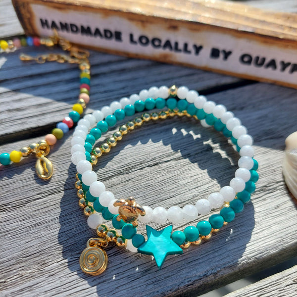 <p data-mce-fragment="1">Gorgeous Handcrafted Collection of 3 Delicate Beaded Bracelets</p> <p data-mce-fragment="1">Each Bracelet is individually designed, (1) 4mm natural white jade beads with cute 18k gold plated turtle (2) 4mm turquoise magnesite beads with star (3) 4mm 18k gold plated beads with hanging swirl charm</p> <p data-mce-fragment="1">Wear altogether or separately for a boho/Surf Chick look!</p>