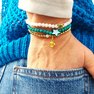 <p data-mce-fragment="1">Gorgeous Handcrafted Collection of 3 Delicate Beaded Bracelets</p> <p data-mce-fragment="1">Each Bracelet is individually designed, (1) 4mm natural white jade beads with cute 18k gold plated turtle (2) 4mm turquoise magnesite beads with star (3) 4mm 18k gold plated beads with hanging swirl charm</p> <p data-mce-fragment="1">Wear altogether or separately for a boho/Surf Chick look!</p>