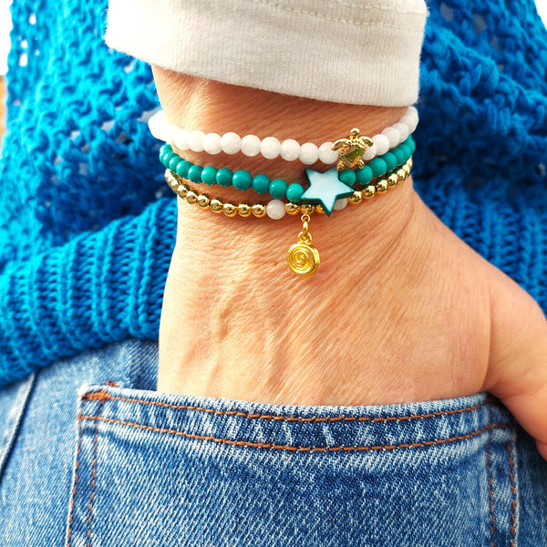 <p data-mce-fragment="1">Gorgeous Handcrafted Collection of 3 Delicate Beaded Bracelets</p> <p data-mce-fragment="1">Each Bracelet is individually designed, (1) 4mm natural white jade beads with cute 18k gold plated turtle (2) 4mm turquoise magnesite beads with star (3) 4mm 18k gold plated beads with hanging swirl charm</p> <p data-mce-fragment="1">Wear altogether or separately for a boho/Surf Chick look!</p>