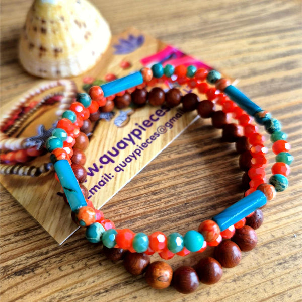 Add a pop of color to your summer looks with these handcrafted, delicate bracelets made with 4mm &amp; 6mm beads. Each one is unique, featuring turquoise &amp; orange stone beads with shell tubes, coral faceted glass, and natural waxed wood. They fit most adult wrists perfectly with their close-fitting elastic design (measuring 7.5 in/19cm). Perfect for adding a touch of fun and flair to your summer wardrobe!