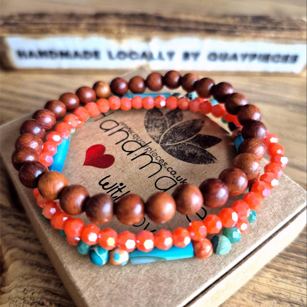 Add a pop of color to your summer looks with these handcrafted, delicate bracelets made with 4mm &amp; 6mm beads. Each one is unique, featuring turquoise &amp; orange stone beads with shell tubes, coral faceted glass, and natural waxed wood. They fit most adult wrists perfectly with their close-fitting elastic design (measuring 7.5 in/19cm). Perfect for adding a touch of fun and flair to your summer wardrobe!