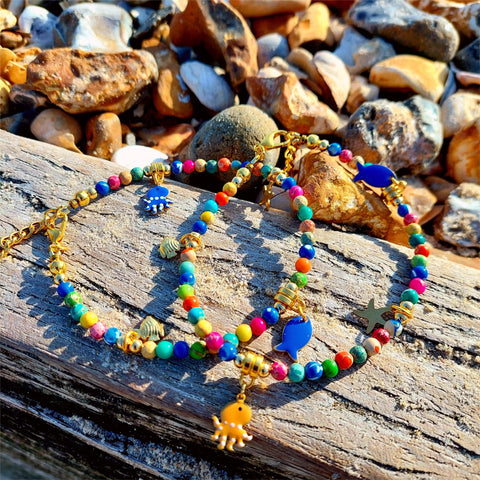 Gorgeous beach anklet, handmade with colourful 4mm imperial jasper stone beads with cute gold plated sea creature charms including an octopus, starfish &amp; 2 fishes


Each anklet has gold plated fastenings &amp; lobster clasp

Length - 23cm extends to 26cm

Perfect gift for any surf chick!

**Presented in lovely Kraft paper gift box with reusable organza pouch**