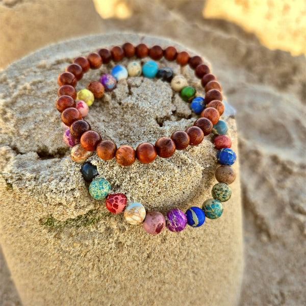 Super cool handcrafted collection of 2 Beaded Bracelets

A duo of 6mm waxed natural wood beads &amp; 6mm multi colour imperial jasper beads
A perfect Summer combination!

Elasticated, so will fit most adult wrists (measuring 7.5 in/19cm)


**Presented in lovely Kraft paper gift box with reusable organza pouch**