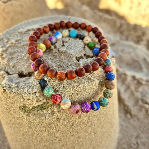 Super cool handcrafted collection of 2 Beaded Bracelets

A duo of 6mm waxed natural wood beads &amp; 6mm multi colour imperial jasper beads
A perfect Summer combination!

Elasticated, so will fit most adult wrists (measuring 7.5 in/19cm)


**Presented in lovely Kraft paper gift box with reusable organza pouch**