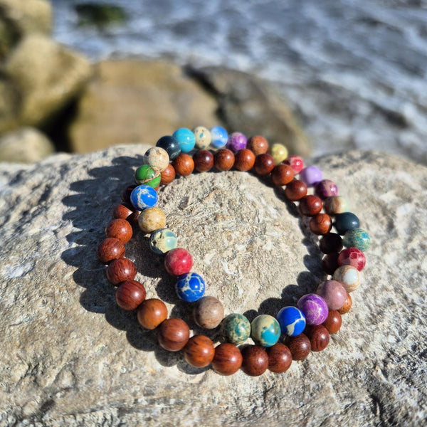 Super cool handcrafted collection of 2 Beaded Bracelets

A duo of 6mm waxed natural wood beads &amp; 6mm multi colour imperial jasper beads
A perfect Summer combination!

Elasticated, so will fit most adult wrists (measuring 7.5 in/19cm)


**Presented in lovely Kraft paper gift box with reusable organza pouch**