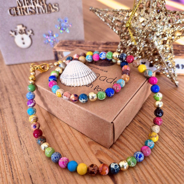 Colorful beaded bracelet on a cardboard box with decorative elements