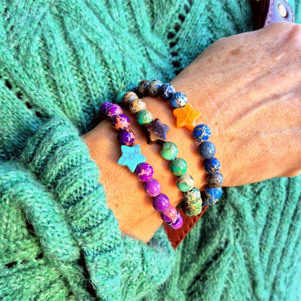 Lovely 8mm bracelets feature beautiful imperial jasper beads paired with a striking contrasting stone star—a delightful pop of personality on your wrist. Whether you're reaching for everyday sparkle or searching for the perfect gift to brighten a friend's day, these playful pieces bring joy to any moment. Each bracelet is lovingly made to celebrate individuality and add a touch of whimsy to your style.