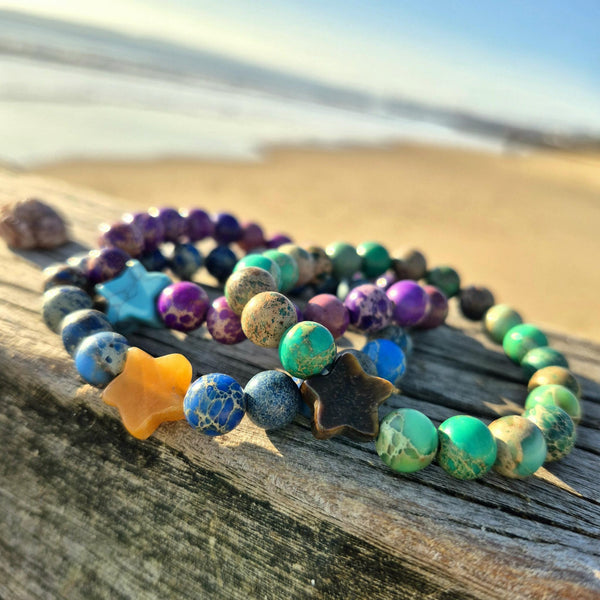 Lovely 8mm bracelets feature beautiful imperial jasper beads paired with a striking contrasting stone star—a delightful pop of personality on your wrist. Whether you're reaching for everyday sparkle or searching for the perfect gift to brighten a friend's day, these playful pieces bring joy to any moment. Each bracelet is lovingly made to celebrate individuality and add a touch of whimsy to your style.