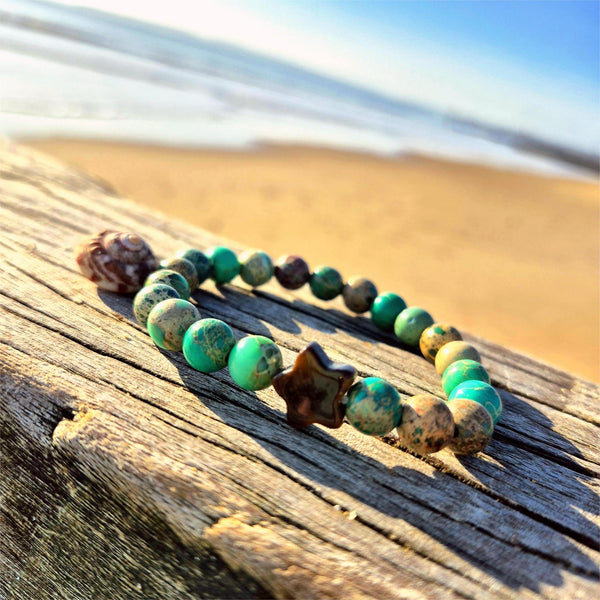 Lovely 8mm bracelets feature beautiful imperial jasper beads paired with a striking contrasting stone star—a delightful pop of personality on your wrist. Whether you're reaching for everyday sparkle or searching for the perfect gift to brighten a friend's day, these playful pieces bring joy to any moment. Each bracelet is lovingly made to celebrate individuality and add a touch of whimsy to your style.