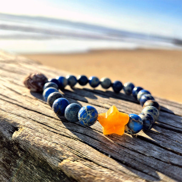 Lovely 8mm bracelets feature beautiful imperial jasper beads paired with a striking contrasting stone star—a delightful pop of personality on your wrist. Whether you're reaching for everyday sparkle or searching for the perfect gift to brighten a friend's day, these playful pieces bring joy to any moment. Each bracelet is lovingly made to celebrate individuality and add a touch of whimsy to your style.