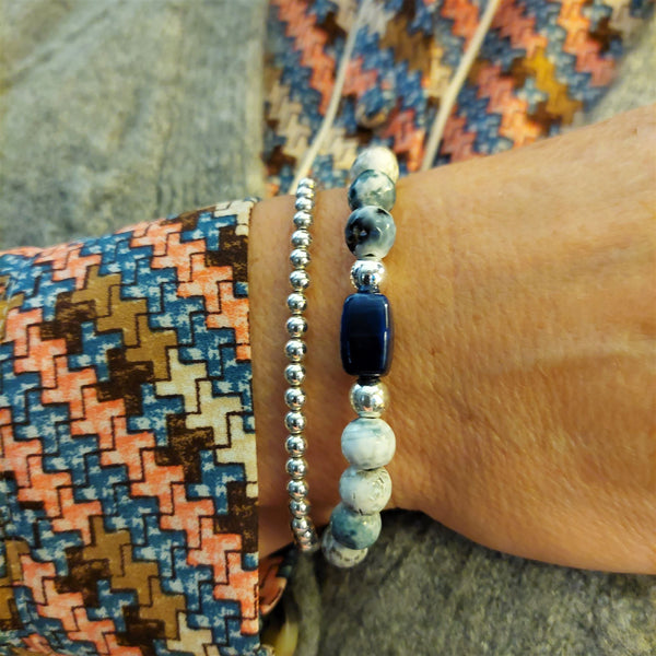 ﻿8mm semi precious faceted cut stone bead bracelet in white/grey/navy opal colour with blue rectangle charm & made with love heart (nickel free)  ﻿Elasticated, so will fit most adult wrists (measuring 71/2 in/19cm)  Lovely gift for friends or family  **Presented in lovely Kraft paper gift box with reusable organza pouch**