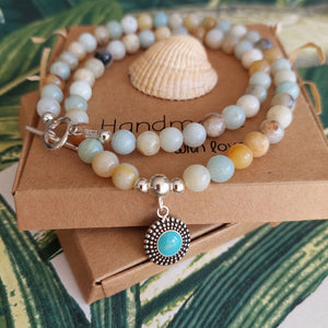 Gorgeous natural stone bead necklace with sterling silver beads & toggle fastening with choice of silver charm.  Length - 42cm  Choose from 1) Yellow beads with starfish                       2) Aqua/brown beads with turquoise circle  A lovely addition to all those summer outfits & Super cute gift for any beach lover!  **Presented in lovely Kraft paper gift box with reusable organza pouch**